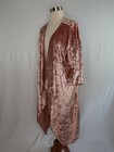 Rose gold pink velvet cover up jacket with draped shawl collar displayed on a dress form against a plain white background.
