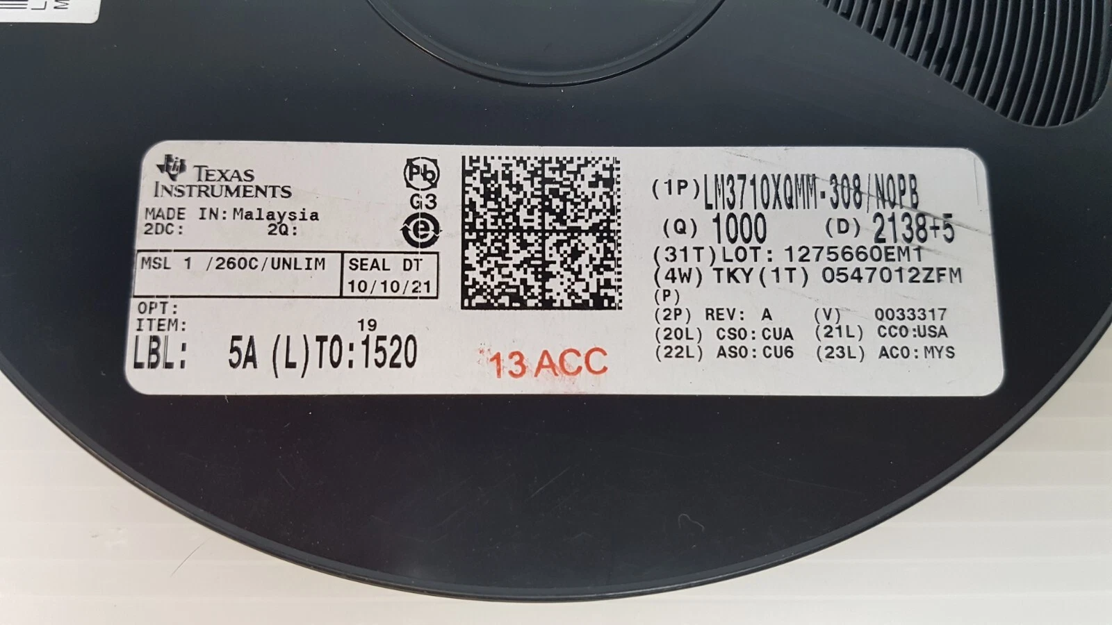 TI reel label close-up: LM3710XQMM-308/NOPB, Q 1000, date code 2138+5, made in Malaysia, MSL 1