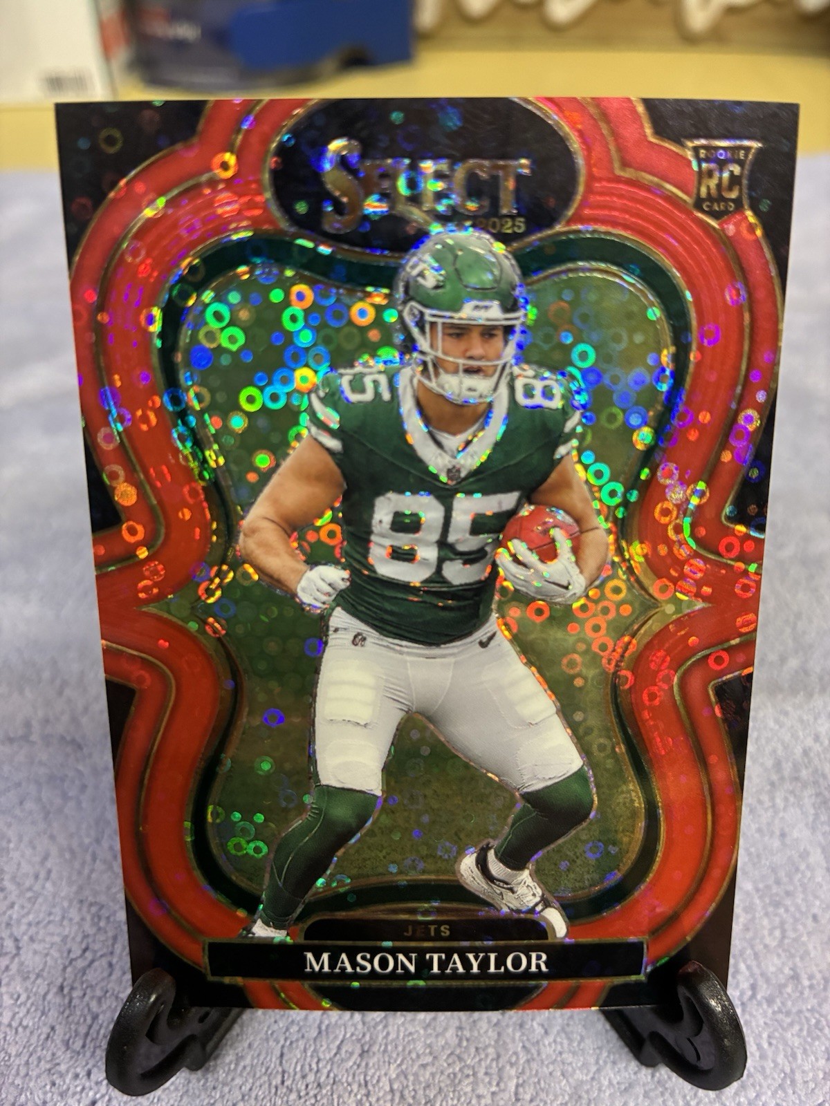 2025 Panini Select - Suite Level #376 Mason Taylor RC Red Disco Prizm /49 (Jets)