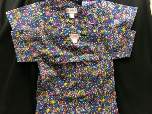 Lot of 2 Scrubs tops-Christina's-flower/heart pattern -blue background XS NEW!