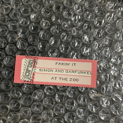 1 JUKEBOX TITLE STRIP ￼ Simon And Garfunkel  Fakin It/ At The Zoo 45