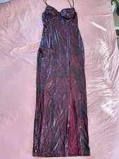 Maxi dress with metallic finish with a dark burgundy snakeskin pattern.
