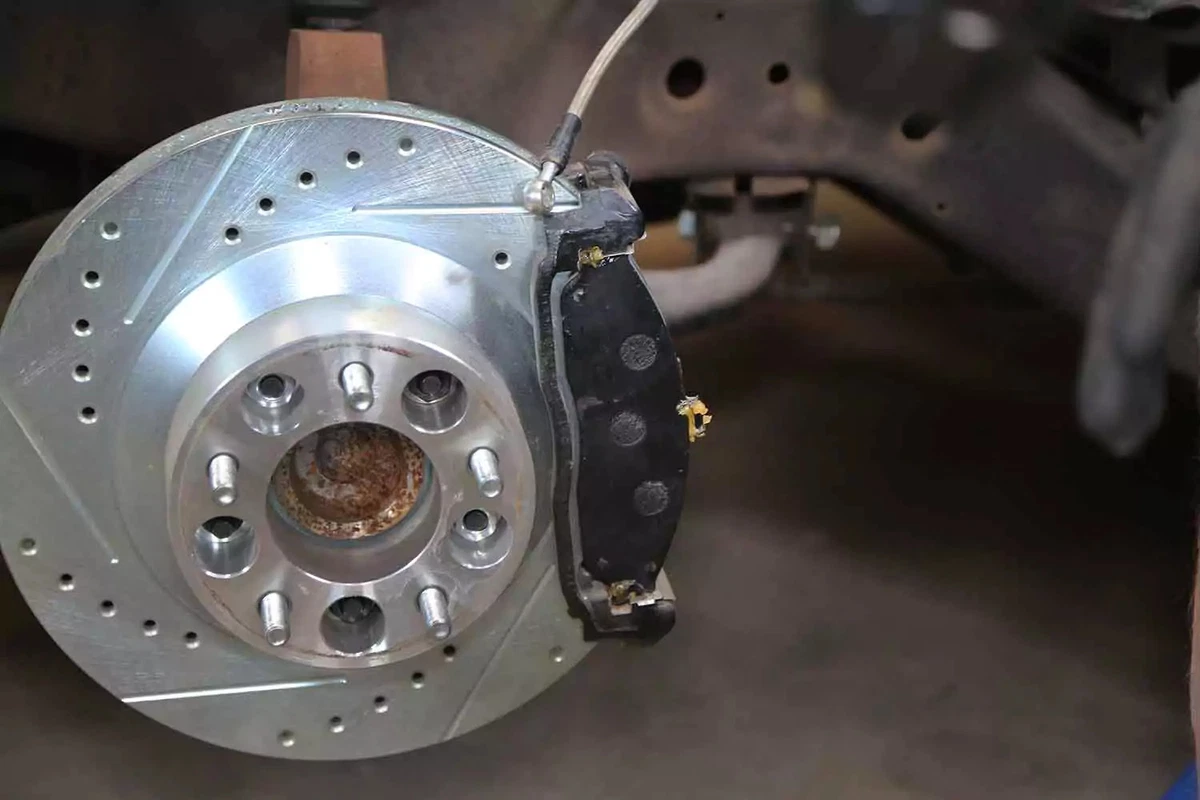 The brake pads are reinstalled into the pad mount.