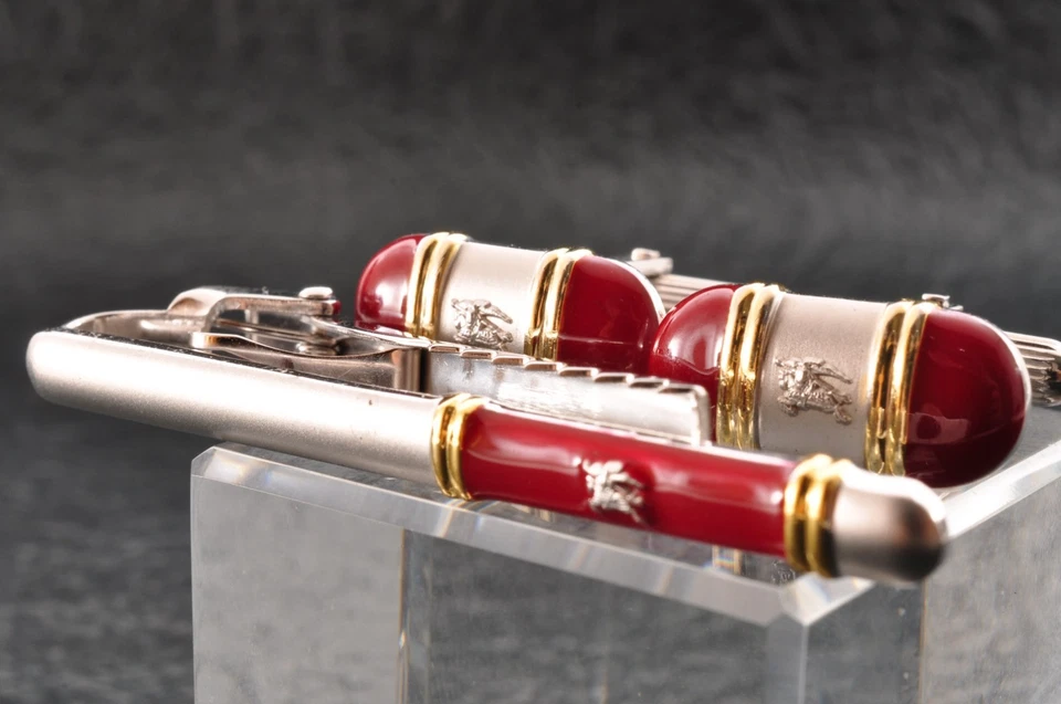 Near mint "Burberry" cufflinks and tie clip silver and red color with brand box. - Image 2 of 4