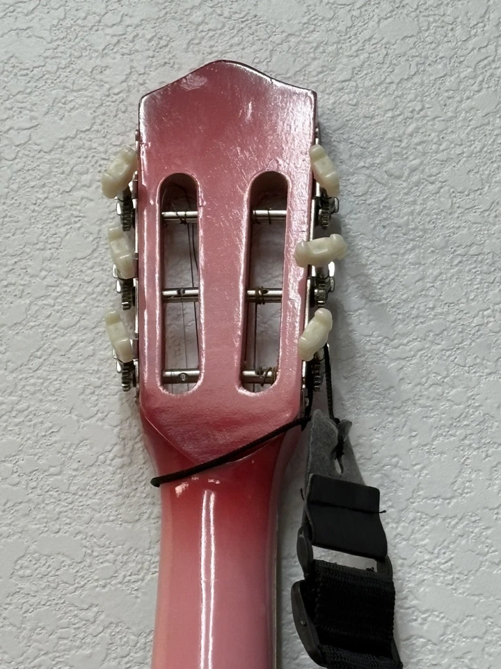 Guitarra rosa media luna Foto 2 de 4