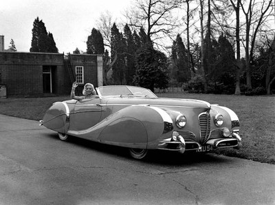 Diana Dors poses at wheel of her ?6 500 gold plated Delahaye sport- Old Photo 1