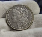 1884 O US Morgan Silver Dollar $1 VF (Harshly Cleaned)