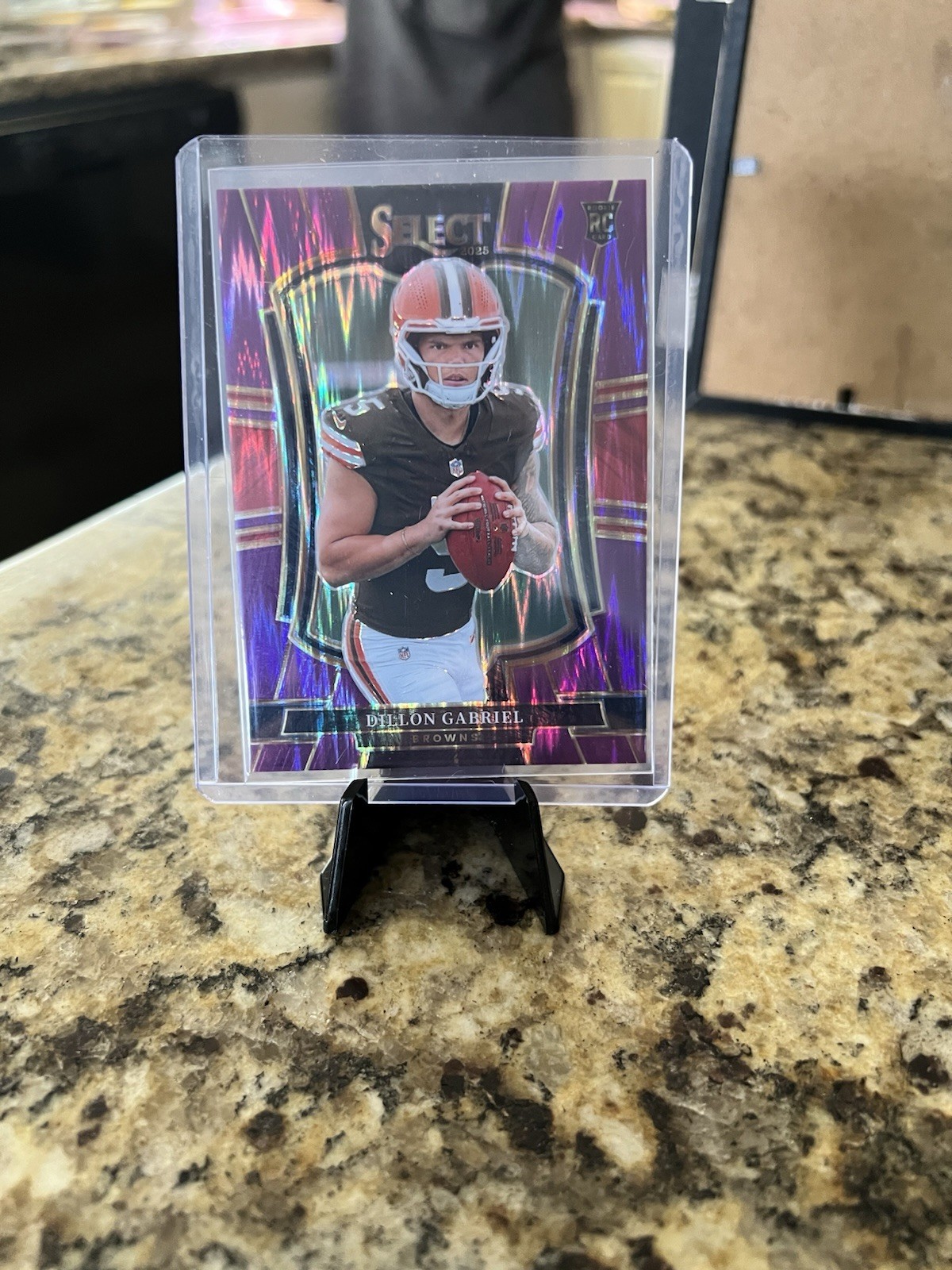 2025 Panini Select Football - #154 Dillon Gabriel Purple Shock Rookie #/699 (SP)