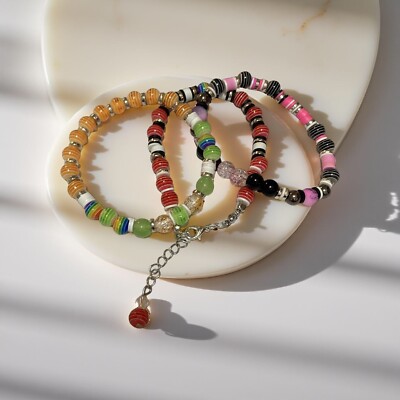 Set of three colorful clay bead unisex handmade bracelets.