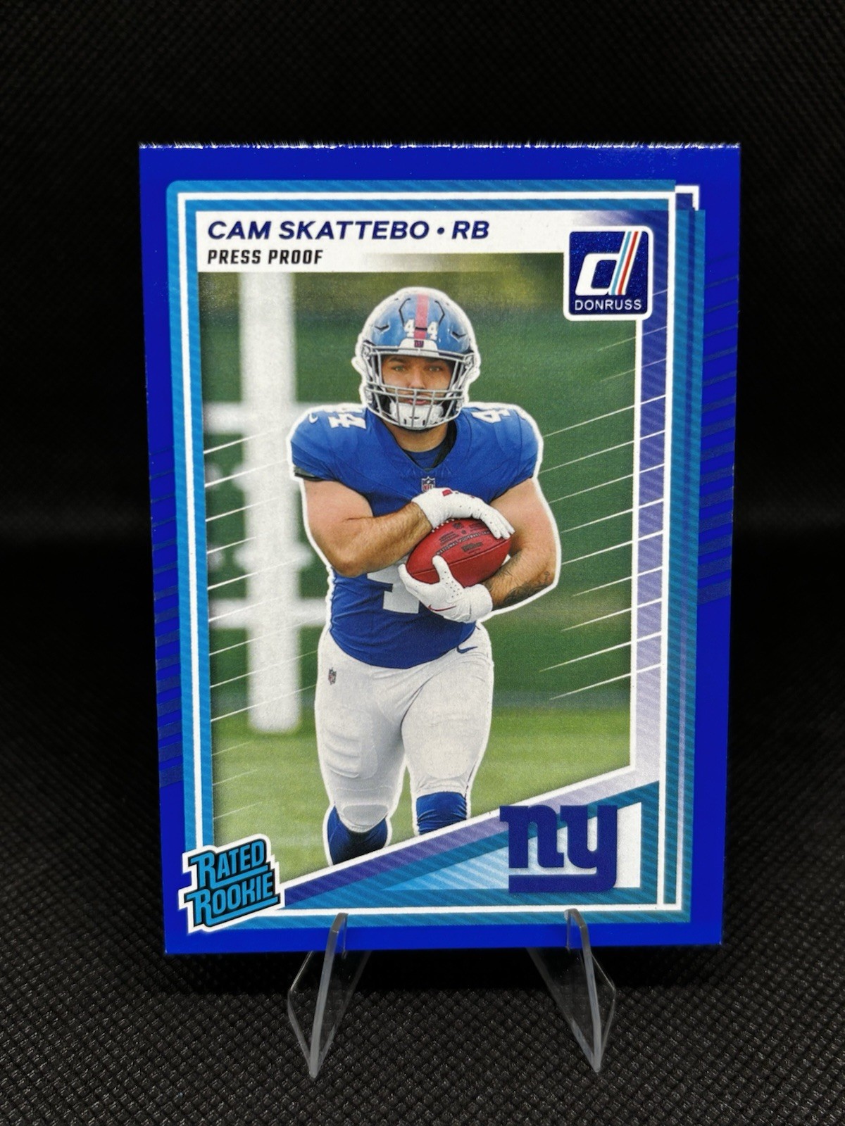 2025 Panini Donruss - Rated Rookie Cam Skattebo #302 Press Proof Blue (RC)