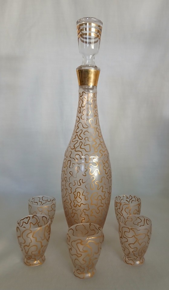 A complete Art Deco Murano glass cordial set with decanter — handmade Italian glassware that's as much sculpture as barware.