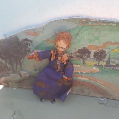 A  Grecon Grandma Dolls  House Doll 3 1/2'' tall W/ Blue Dress. Tag intact.