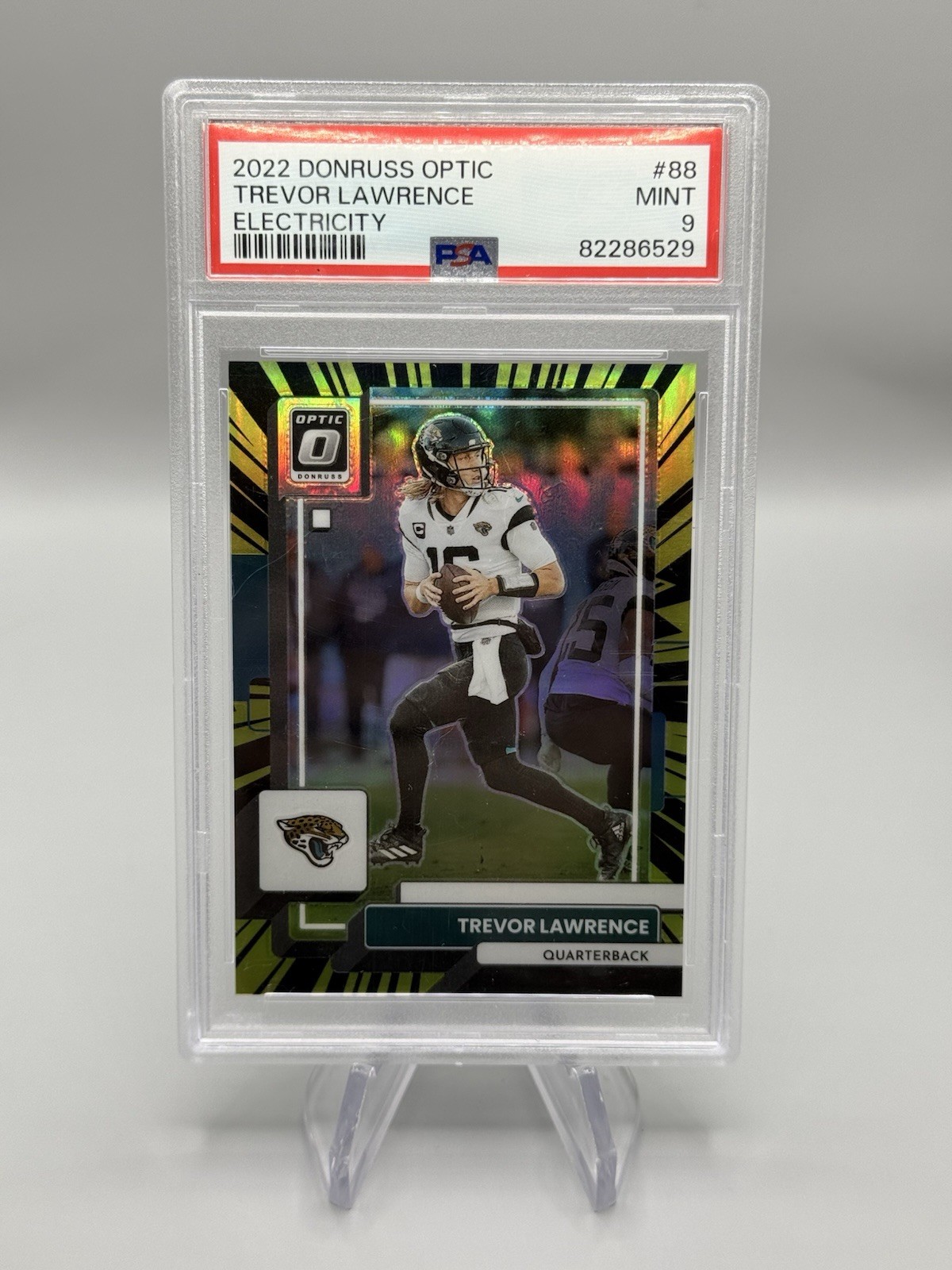 2022 Panini Donruss Optic - Trevor Lawrence #88 Electricity Prizm /65 PSA 9