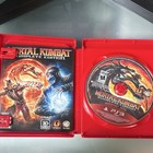 PS3 Mortal Kombat Komplete Edition Greatest Hits case with Scorpion and Sub-Zero in battle, and black game disc labeled with logo.