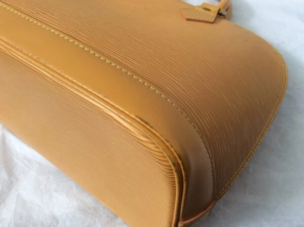 BOLSO DE MANO LOUIS VUITTON EPI ALMA MONEDERO Foto 3 de 4