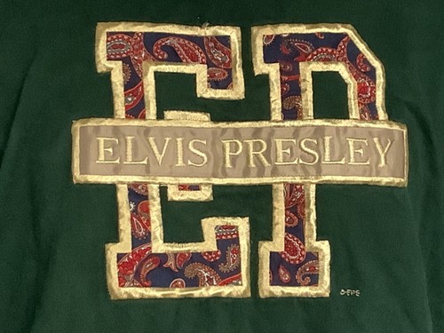 Green and white striped large EPE “ELVIS PRESLEY” T-shirt with gold paisley pattern and black text.