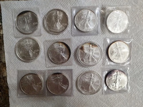 New ListingLot of 12 Silver American Eagle 1 oz. Fine .999 US oz Coins Various Years