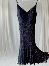 Vintage 1990s Versace black dress with floral sequin detailing.