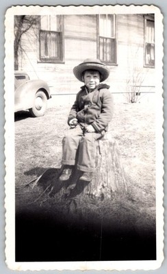 Vtg B&W Snapshot Boy In Large Hat Sitting On Tree Stump By 1930s Style Car 1940s