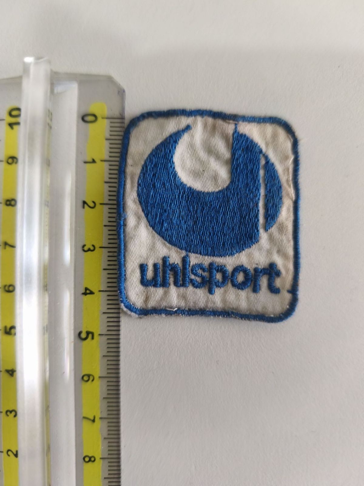 TOPPA PATCH CALCIO ANNI 80'S UHLSPORT BLU USATA D'EPOCA da Cucire