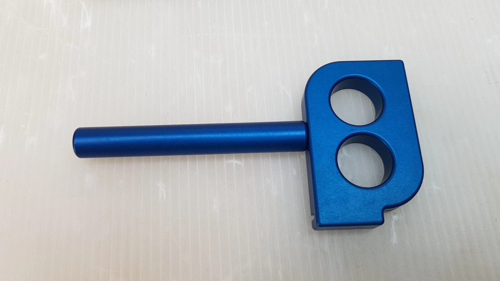 Blue FiberLase HP Bending Tool with two round openings and handle rod
