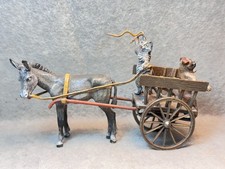 Vienna Bronze Donkey Pulling a Cart with a Cat Driving and a Pug on the Tailgate