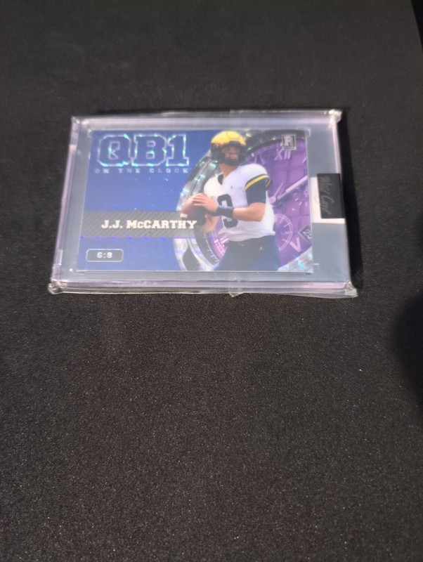 2023 Wild Card Qb1 On the Clock #OCW-JM1 J.J. McCarthy RC Blue/Purple Mosaic/8