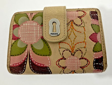 Fossil tan leather bifold snap wallet with a floral print.