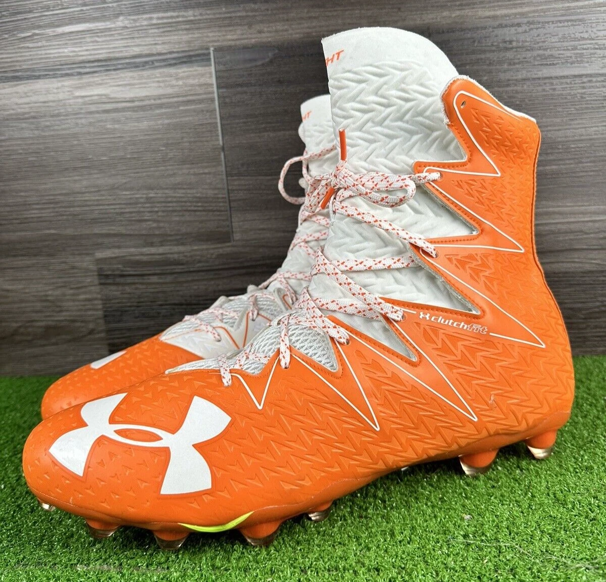 Under armour shop football cleats orange