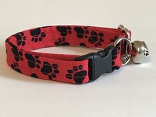 BLACK PAW PRINTS ON RED ADJUSTABLE BREAKAWAY CAT COLLAR