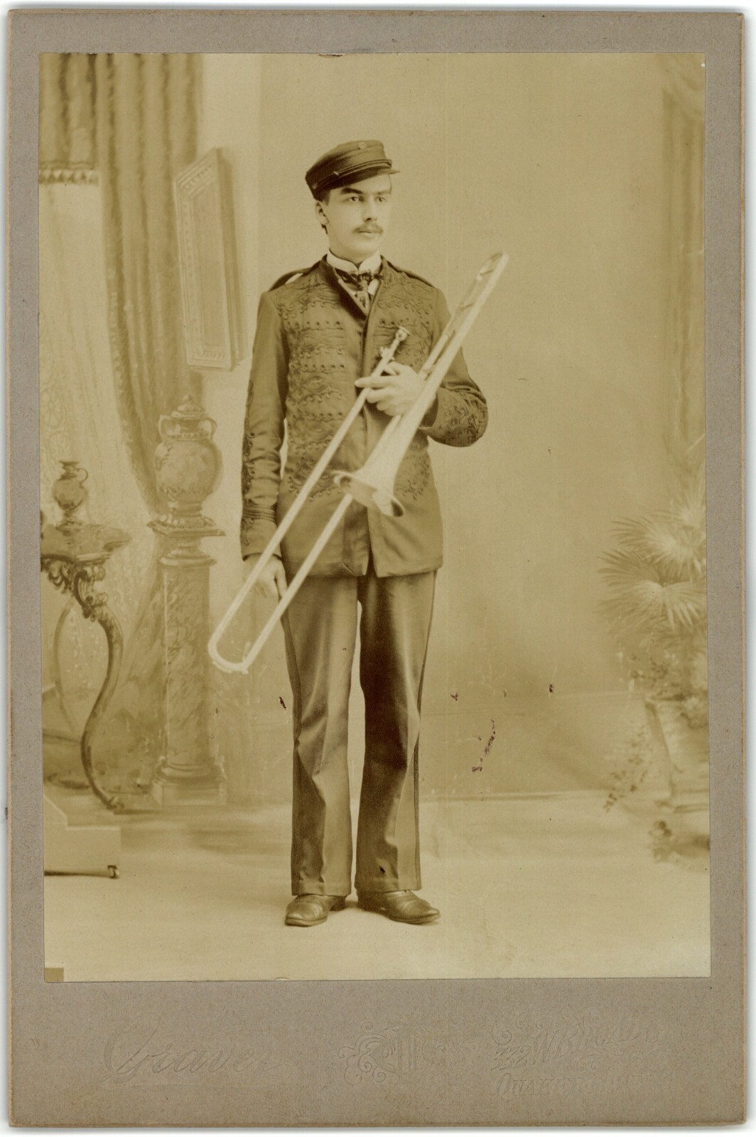 C. 1890s CABINET CARD GRAVER SOLDIER IN UNIFORM HOLDING TROMBONE QUAKERTOWN PA.