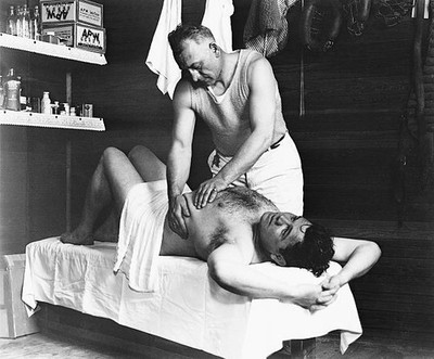 Baseball champion Babe Ruth getting a rubdown from Yankee trainer - Old Photo