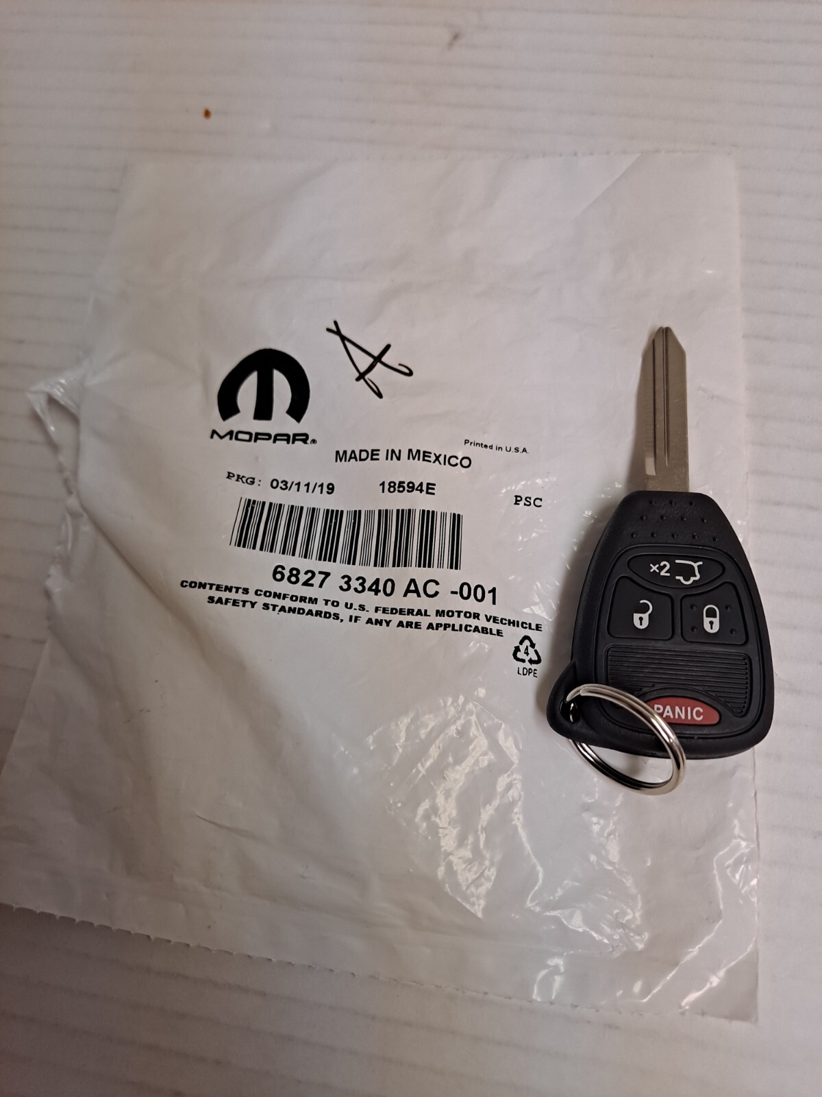 Keyless Entry TransmitterSport, VIN 5 Mopar 68273340AC fits 2006 Jeep