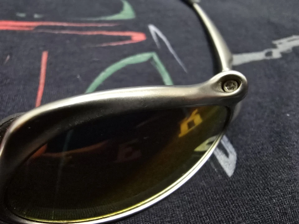 MARCO OAKLEY X-METAL PENNY TITANIO CON RUBÍ IRIDIO SERIALIZADO  Foto 3 de 4