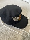 Black vintage baseball cap with white winged logo and “REO Speedwagon” text, RARE USA Made cycling cap.
