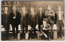 Travellers Crew Near a train - Location unknown RPPC