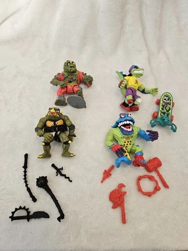 Vintage lot of 11 Vintage Teenage Mutant Ninja Turtles action figures.
