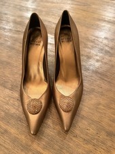 Stuart Weitzman gold-tone pumps with a pointed toe and crystal embellishment 8M