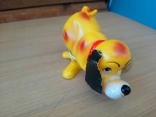 Vintage retro dog litho tin. The yellow dog soft vinyl tin wind up powered Japan