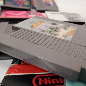 Lot of 8 NES Games Ikari Warriors II Jackal Trojan Strider Captain Comic CIB