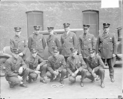 Eleven Firemen Members Of A Horseshoe Team Posing In Front Of A B - Old Photo