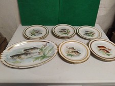SERVICE À POISSONS LIMOGES FRANCE PLAT ET 9 ASSIETTES EN TRÈS BON ÉTAT. 34.