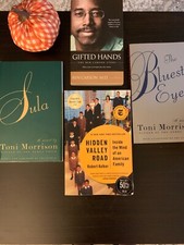 Four turn page Books (4) Toni Morrison, Ben Carson, and Robert Kolker