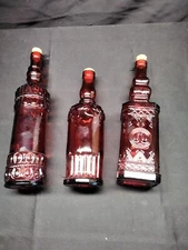 Decorative red glass bottles with corks