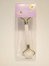 Stone facial roller and de puff NEW IN BOX roller is 5-1/4 inches long D12
