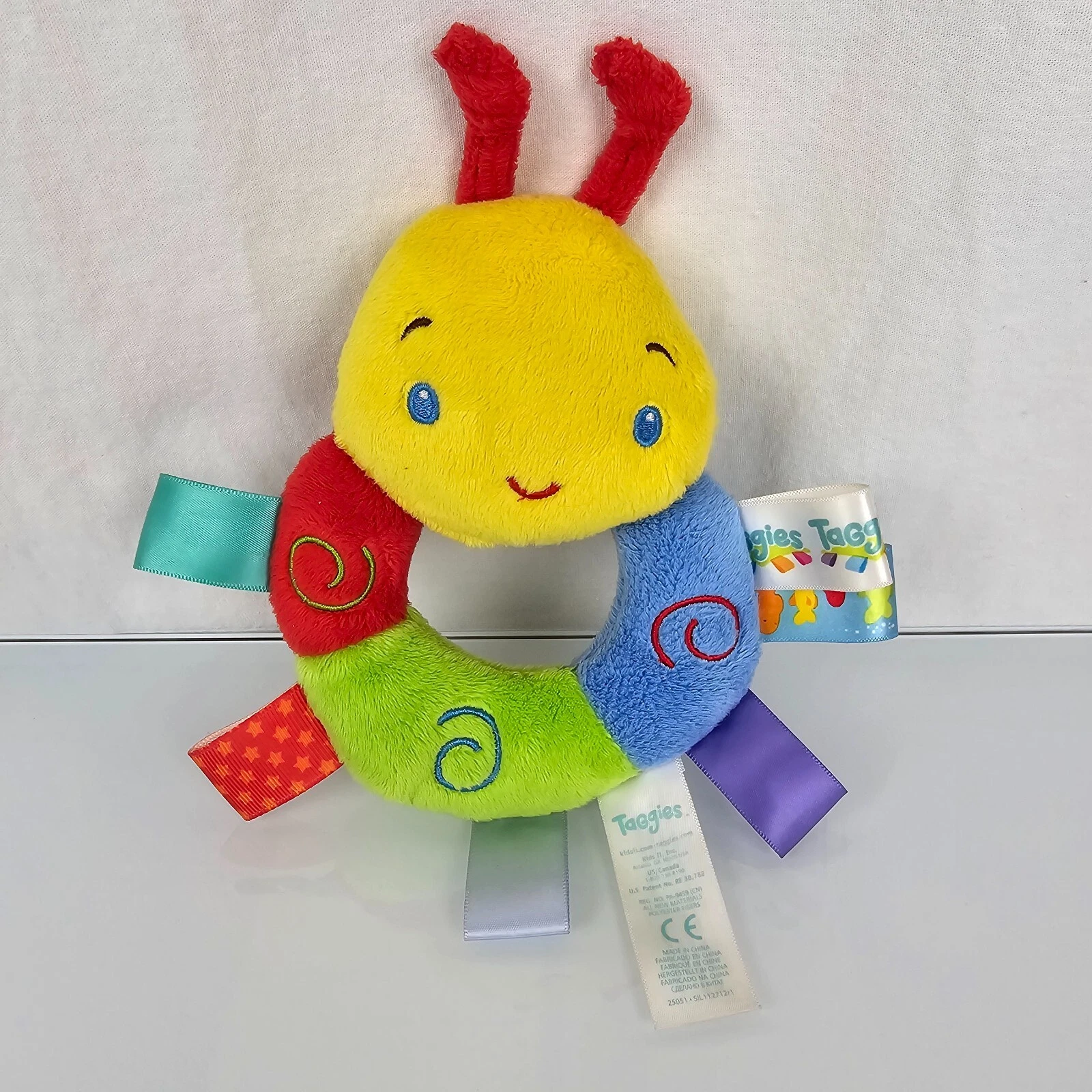 Taggies Stuffed Plush Caterpillar Rainbow Rattle Baby Toy with Ribbon Tags