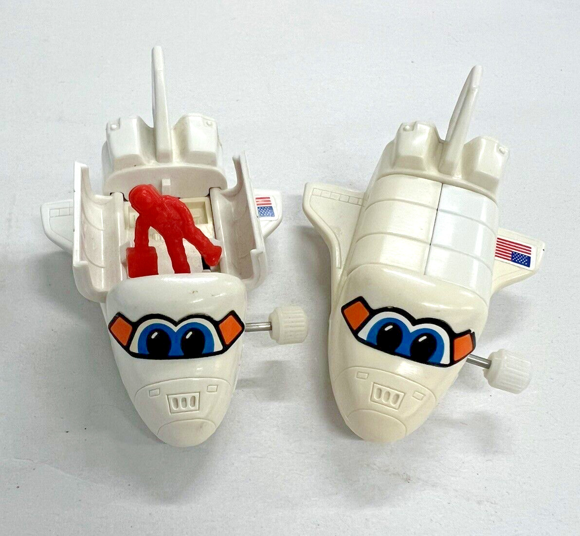 2 TOMY Wind Up Toy Space Shuttles with Orange Astronaut Doors Open/Close Works