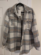 women's flannel plaid shacket shirt jacket in gray and white.