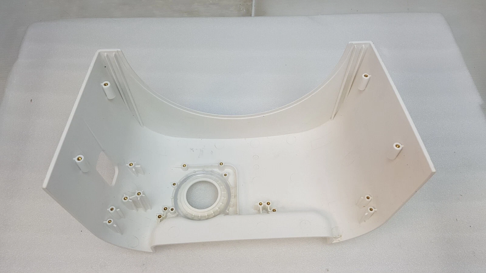Inside of the Lumenis Pulse cover showing molded screw bosses around the port opening
