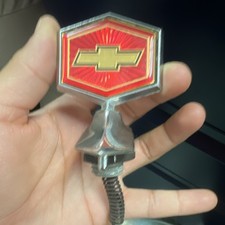 NOS 80 87 CHEVY MALIBU ELCAMINO HOOD ORNAMENT HEADER EMBLEM EL CAMINO 14011341